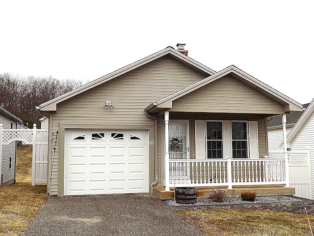 ranch-style house featuring a garage and a porch