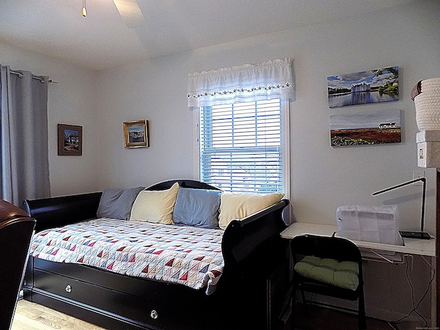 bedroom with ceiling fan and hardwood / wood-style floors