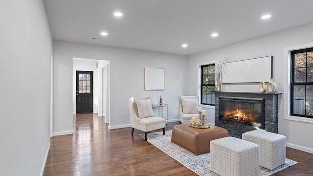 sitting room with dark hardwood / wood-style flooring