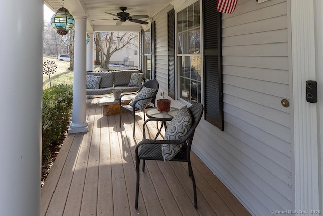 deck featuring ceiling fan and a porch