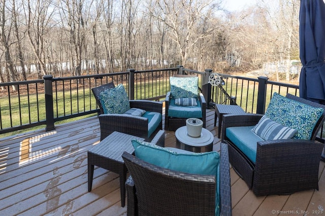 wooden terrace featuring a yard