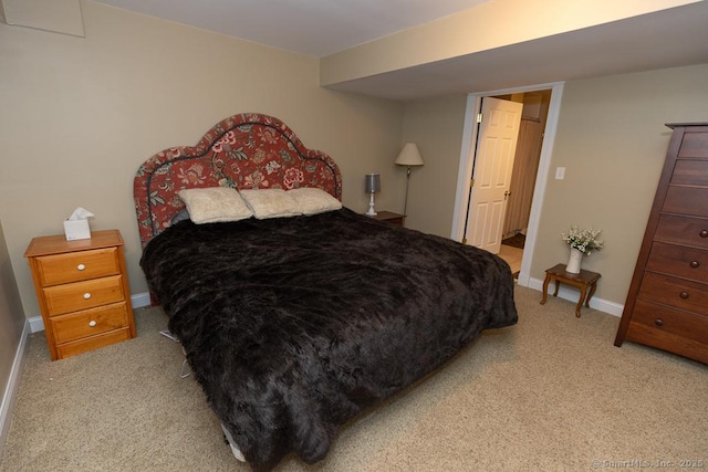 bedroom featuring carpet and baseboards