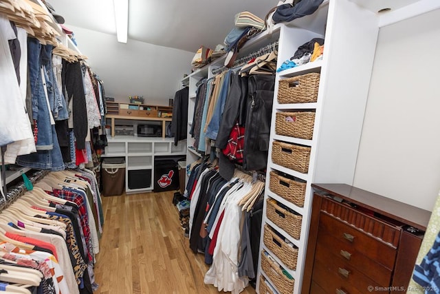 walk in closet featuring light wood-style flooring