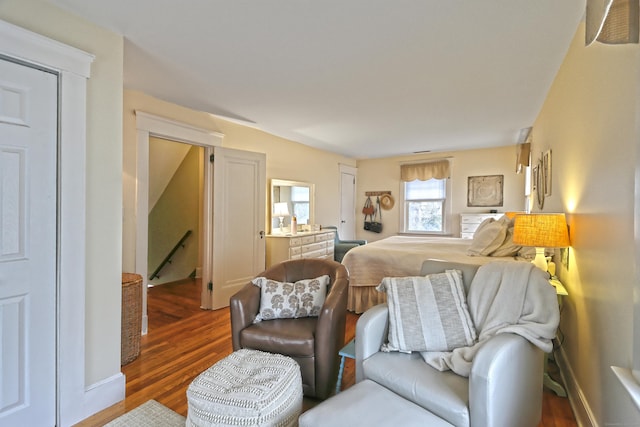 bedroom with dark hardwood / wood-style flooring