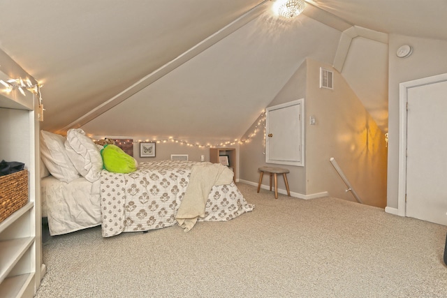 carpeted bedroom with vaulted ceiling