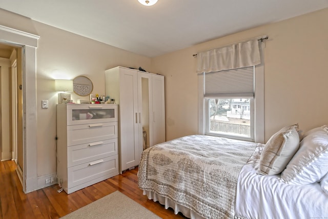 bedroom with hardwood / wood-style flooring