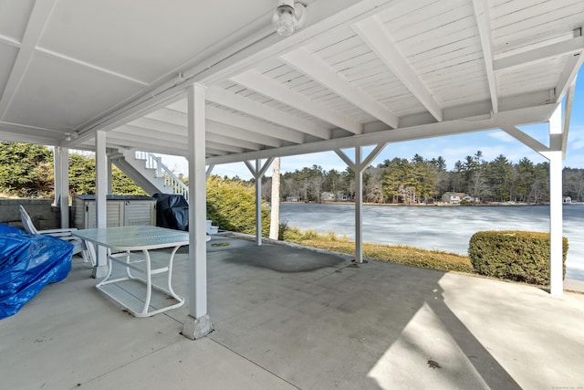 view of patio / terrace featuring outdoor dining area, stairway, and area for grilling