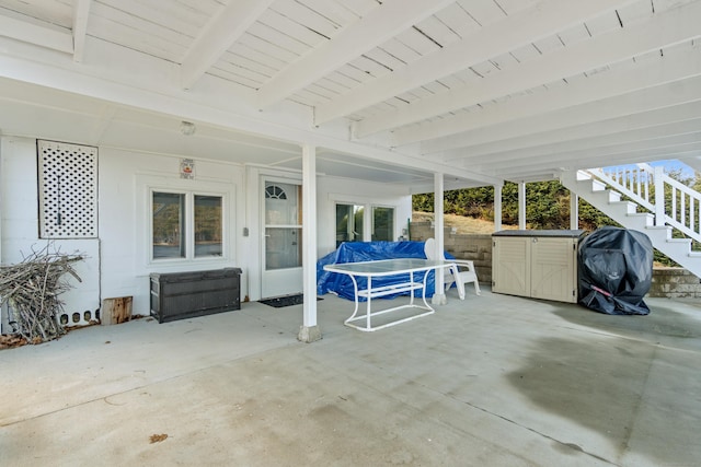 view of patio featuring area for grilling and stairs