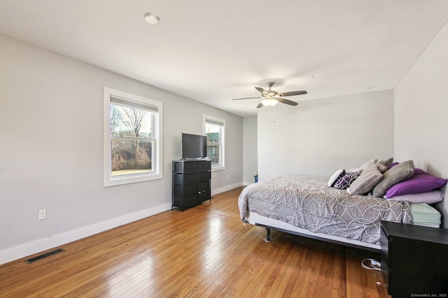 bedroom featuring ceiling fan and wood-type flooring