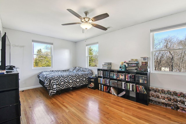 bedroom featuring ceiling fan and hardwood / wood-style flooring