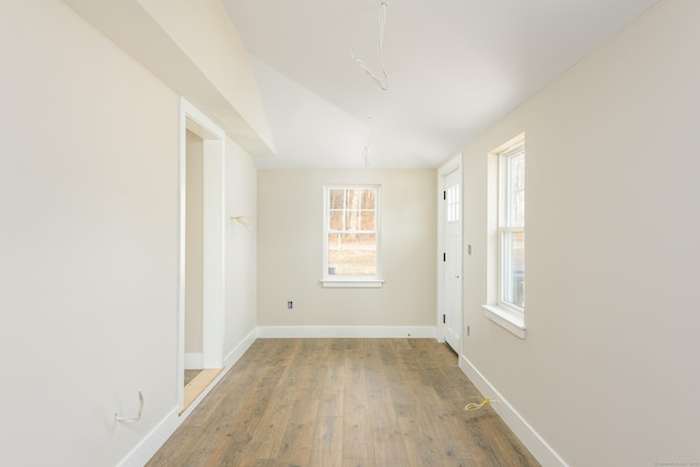 empty room with hardwood / wood-style flooring