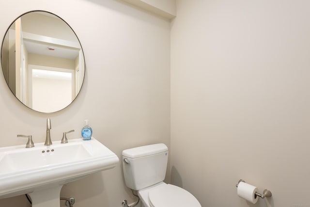 bathroom featuring sink and toilet