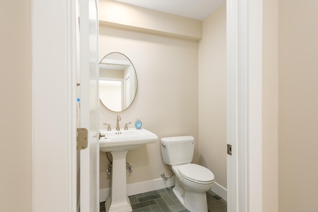 bathroom featuring toilet