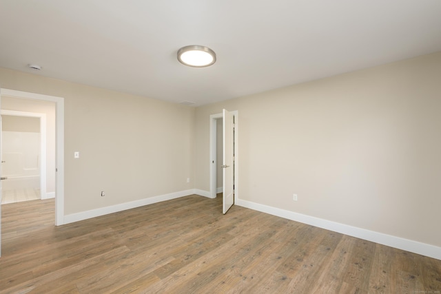 empty room featuring wood-type flooring