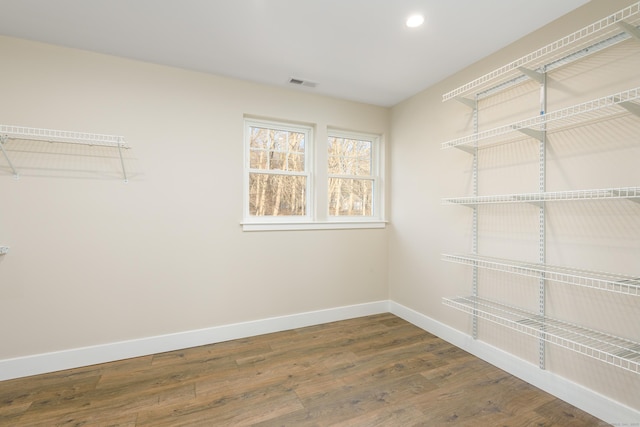 walk in closet featuring dark hardwood / wood-style floors