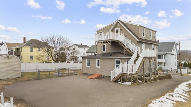 back of house featuring a deck