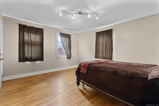 bedroom with light hardwood / wood-style floors