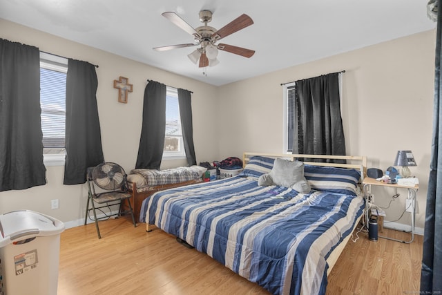 bedroom featuring ceiling fan and hardwood / wood-style floors