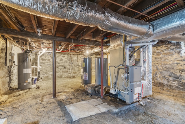 basement featuring electric water heater, heating unit, and water heater