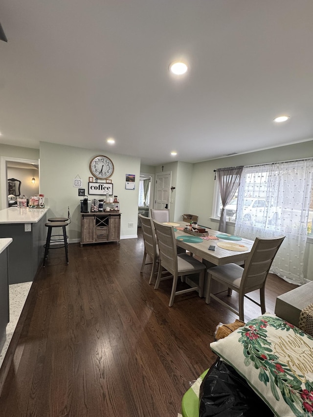 dining space with dark wood-type flooring