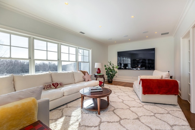 living area featuring crown molding, recessed lighting, visible vents, and wood finished floors