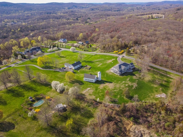 aerial view featuring a wooded view