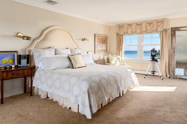 bedroom with a water view, a baseboard heating unit, crown molding, and carpet flooring