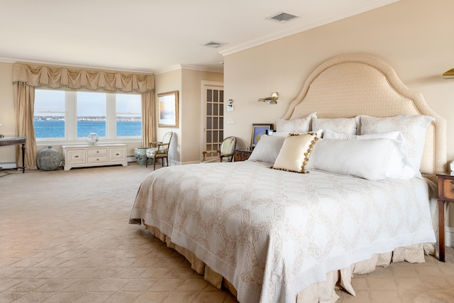 carpeted bedroom featuring ornamental molding and a water view