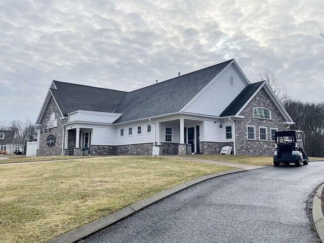 view of side of property featuring a yard