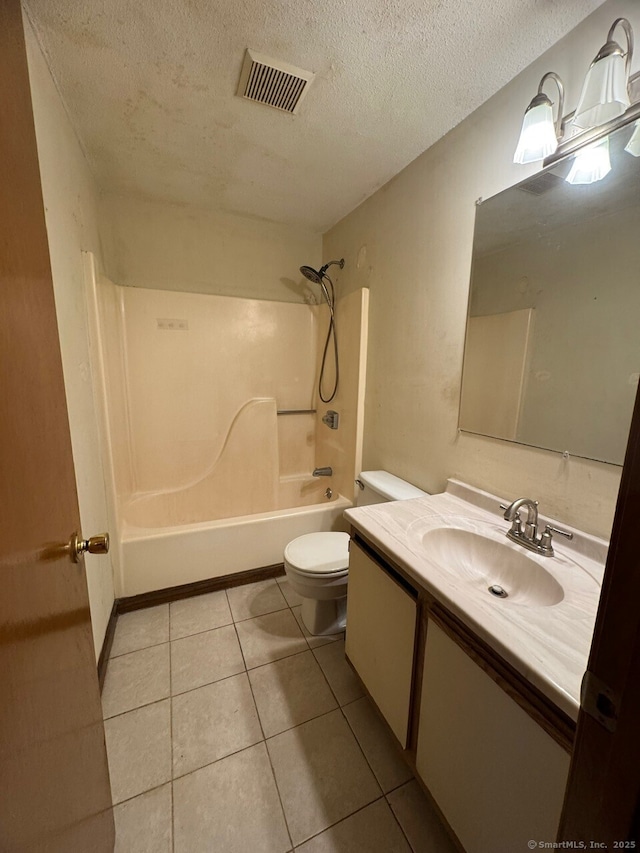 full bathroom with toilet, a textured ceiling, shower / bathing tub combination, tile patterned floors, and vanity