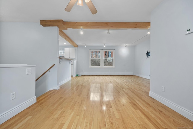 unfurnished living room featuring light hardwood / wood-style floors, a baseboard heating unit, ceiling fan, track lighting, and beam ceiling