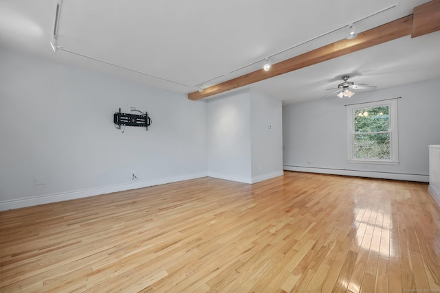 spare room with baseboard heating, rail lighting, light hardwood / wood-style flooring, and ceiling fan