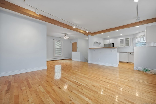 unfurnished living room featuring a baseboard heating unit, ceiling fan, track lighting, and light hardwood / wood-style flooring