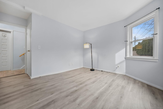 unfurnished room with light hardwood / wood-style flooring