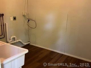 washroom with washer hookup and dark hardwood / wood-style floors