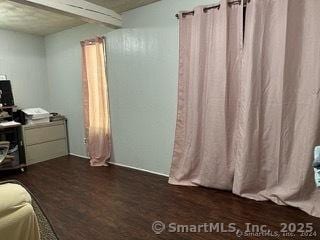 bedroom featuring dark wood-type flooring