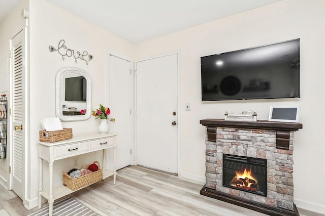 interior space featuring a fireplace and light wood-type flooring