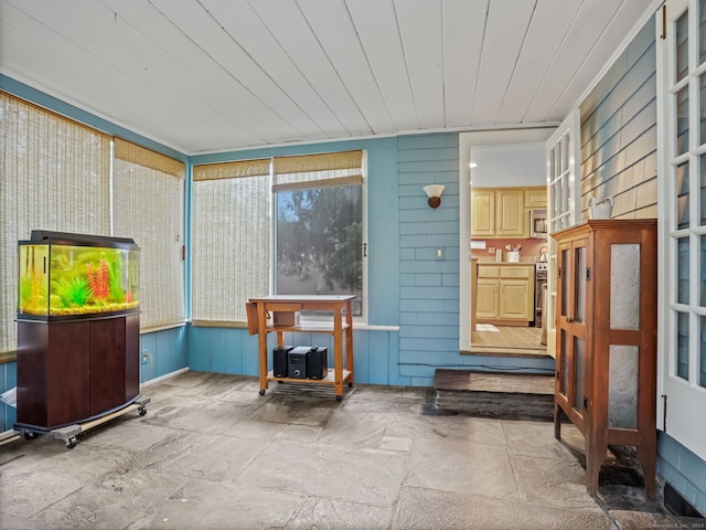 sunroom featuring wood ceiling