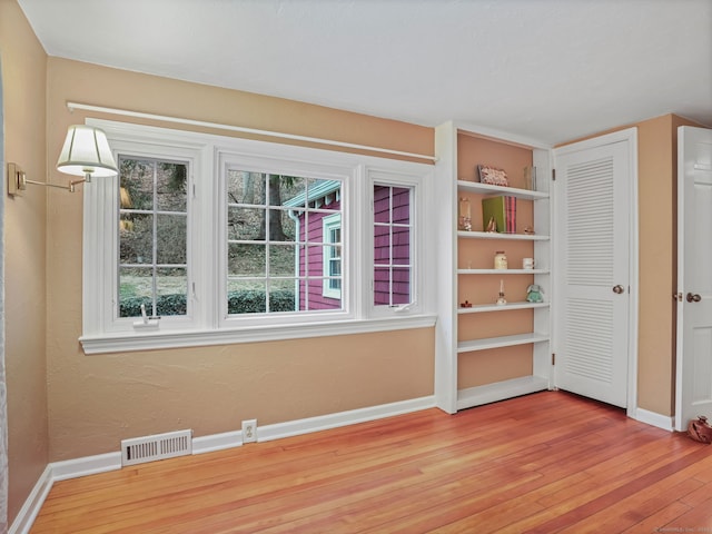 empty room with light wood-type flooring