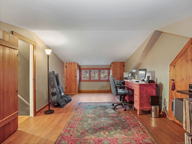 office area with lofted ceiling and light hardwood / wood-style floors