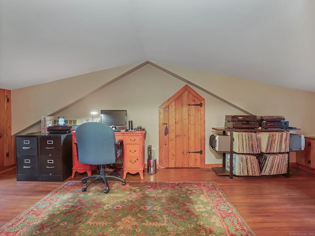 office space with hardwood / wood-style flooring and vaulted ceiling