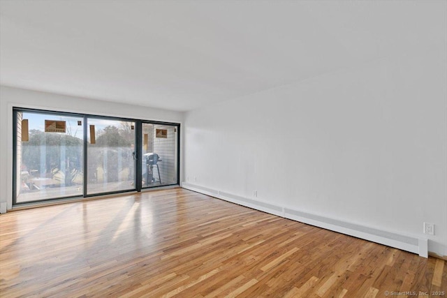 spare room with light hardwood / wood-style floors