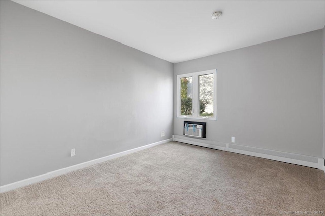 carpeted empty room with a wall unit AC