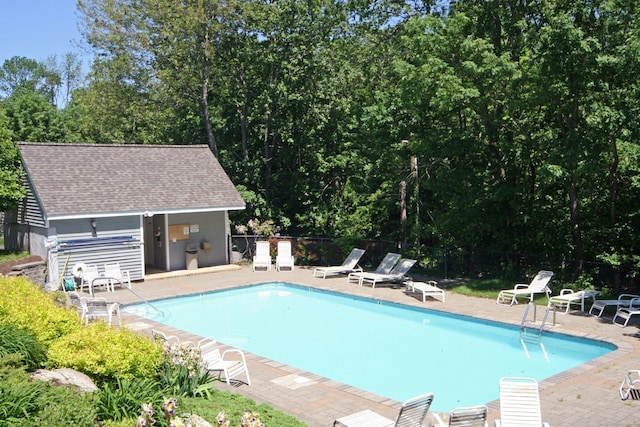 view of swimming pool featuring a patio area