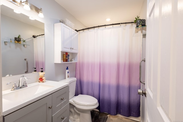 bathroom featuring hardwood / wood-style floors, toilet, and vanity