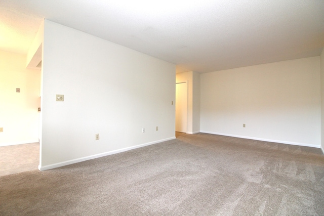 empty room featuring carpet flooring