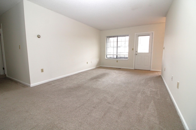 empty room featuring light colored carpet