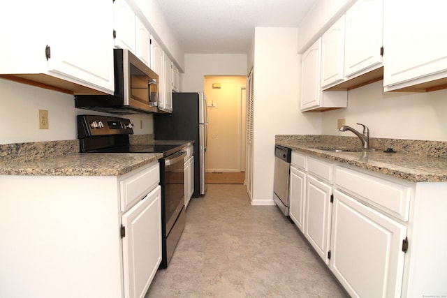 kitchen featuring stainless steel appliances, white cabinets, and sink