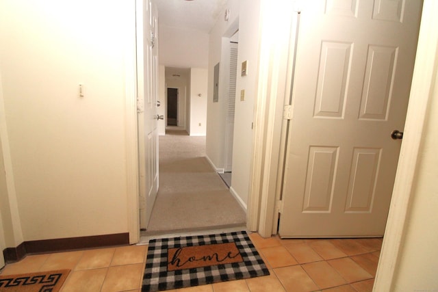 hallway with light tile patterned floors