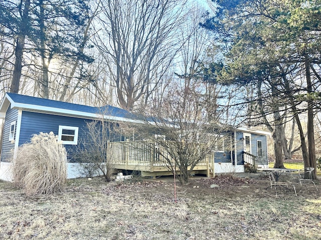 view of side of home featuring a deck